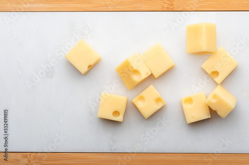 Tableau sur toile Portions (cubes, dice) of Emmental Swiss cheese