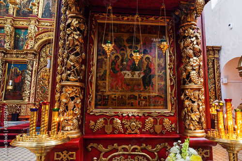 Orthodox Church. Christianity. Festive interior decoration with burning candles and icon in traditional Orthodox Church on Easter Eve or Christmas. Religion faith pray symbol.