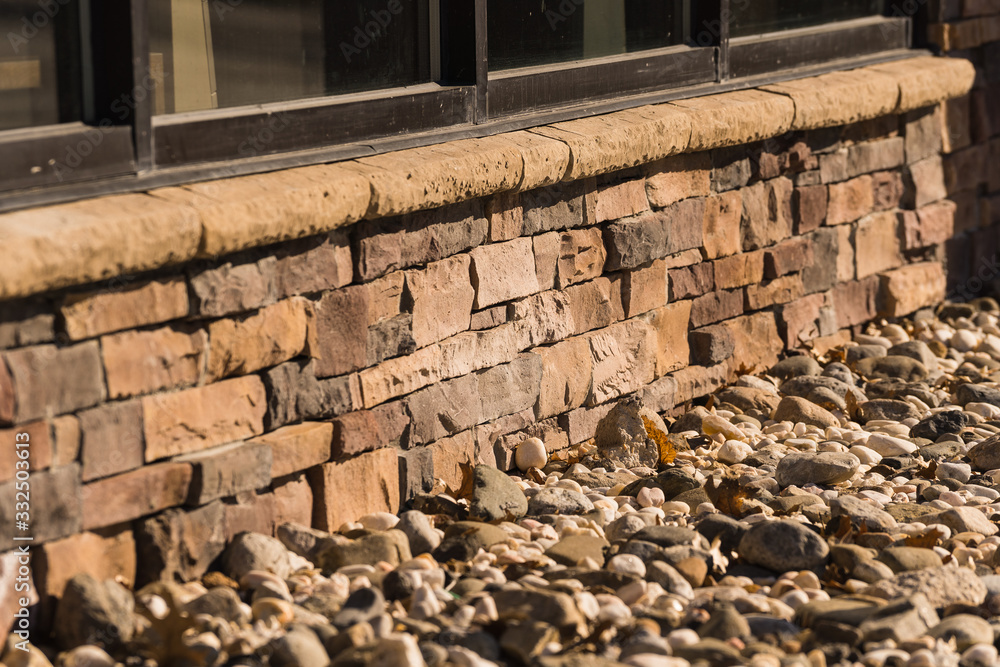 architectural detail of rustic brick wall and stones architectural detail of rustic brick wall and stones