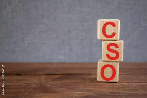 CSO (Chief Security Officer) acronym on wooden cubes on dark wooden backround. Business concept.