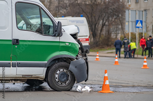 Heavily damaged car after car crash accident on a city street.