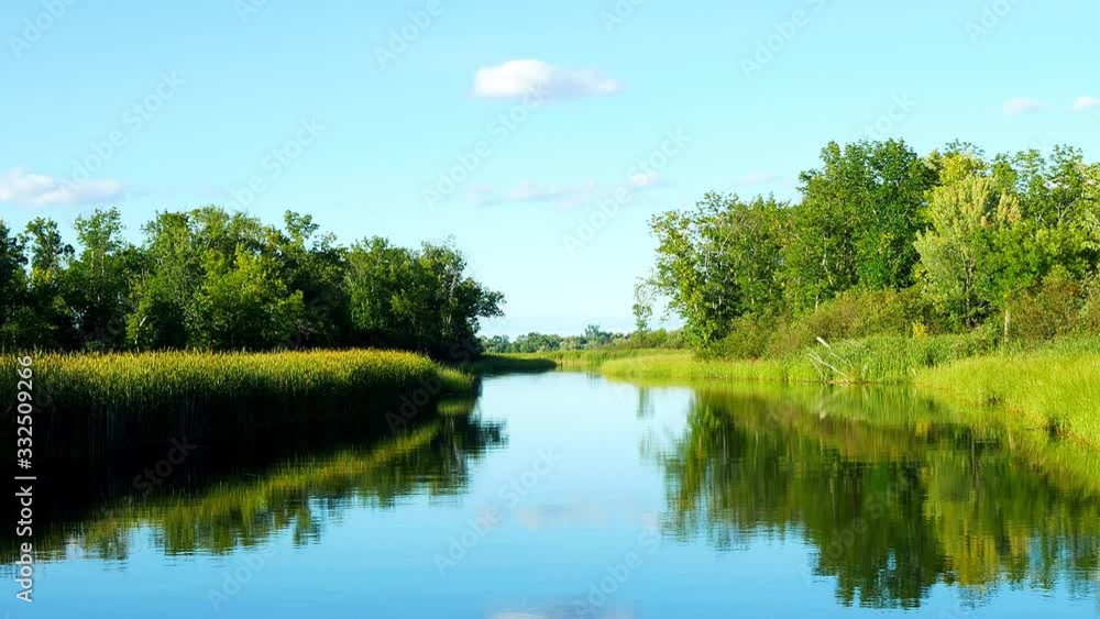The beautiful Mississippi River near highway 2 in Bemidji, Minnesota in a clip from the POV of a moving boat. This scene is a few miles from the rivers source at Lake Itasca. The beautiful Mississippi River near highway 2 in Bemidji, Minnesota in a clip from the POV of a moving boat. This scene is a few miles from the rivers source at Lake Itasca.