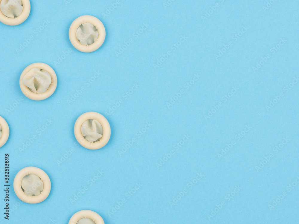Rubber protection for cut fingers on the blue background. Rubber protection for cut fingers on the blue background.