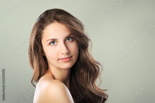 Portrait of smiling woman with perfect skin