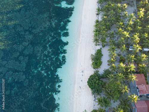 Aerial top down view of Algeria Beach on a tropical paradise island of Siargao, Philippines © Aleksandr