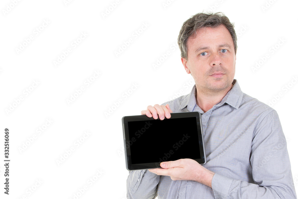 Young man holding in hands tablet computer with blank screen black isolated over white background Young man holding in hands tablet computer with blank screen black isolated over white background