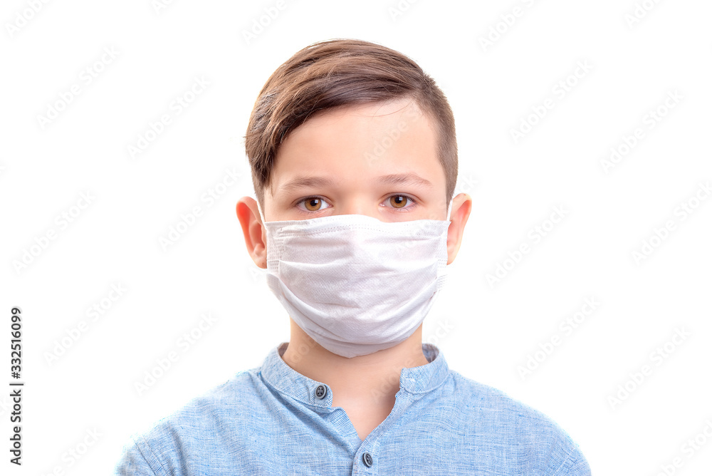 Handsome brunette boy in medicime mouth mask over white background Handsome brunette boy in medicime mouth mask over white background