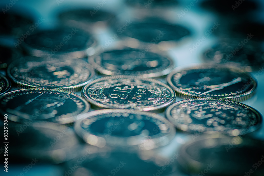 Swiss coins two francs lie on a light background. Swiss coins two francs lie on a light background.