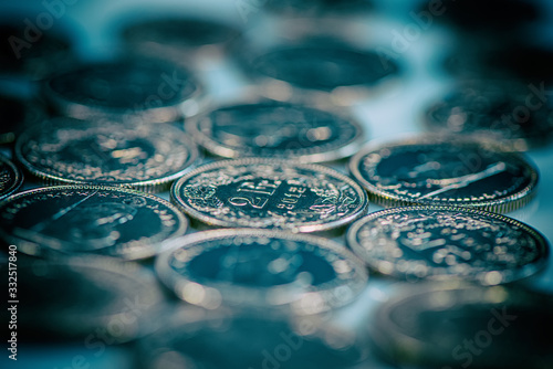 Billede på lærred Swiss coins two francs lie on a light background.