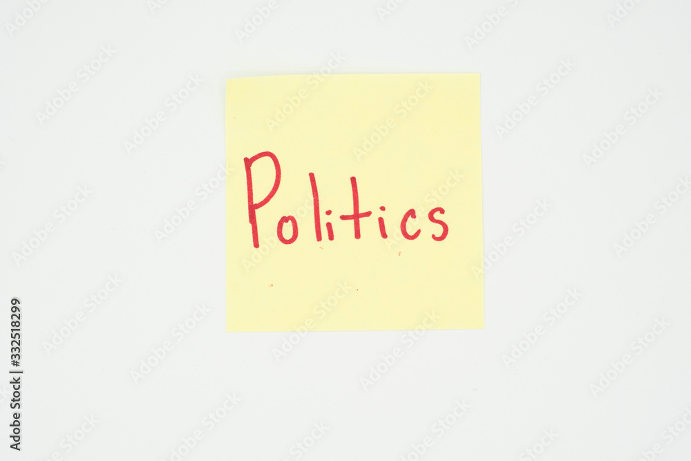 Politics written on a yellow sticky note with copyspace. Presidential election 2020 Politics written on a yellow sticky note with copyspace. Presidential election 2020