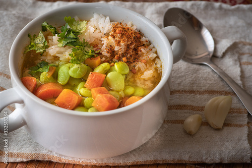 Vegan lima beans, carrot and rice soup photo