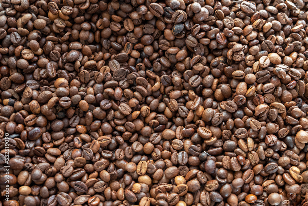 roasted brown coffee beans top view. rough surface texture roasted brown coffee beans top view. rough surface texture
