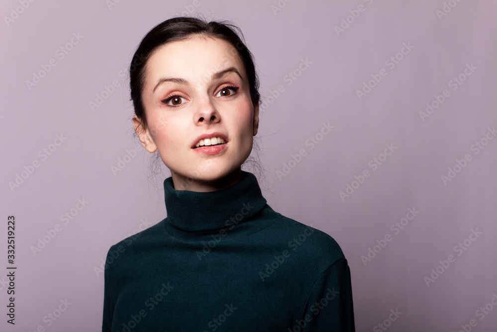 beautiful girl in a green turtleneck on a gray photo beautiful girl in a green turtleneck on a gray photo