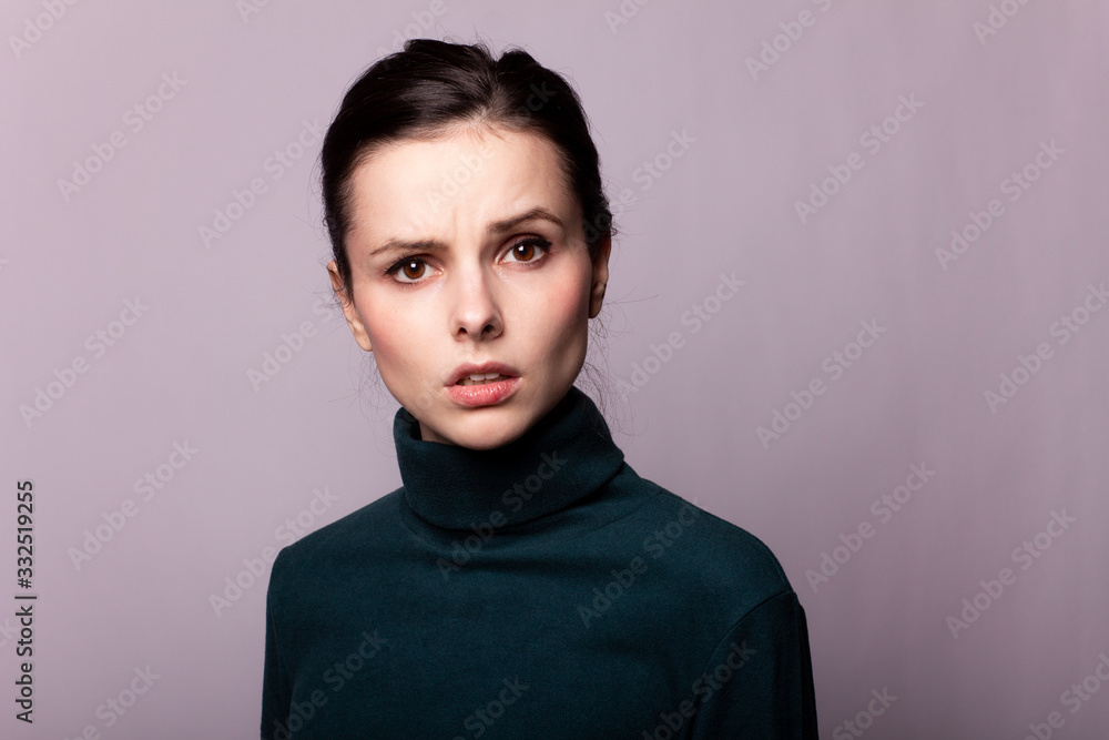 beautiful girl in a green turtleneck on a gray photo beautiful girl in a green turtleneck on a gray photo