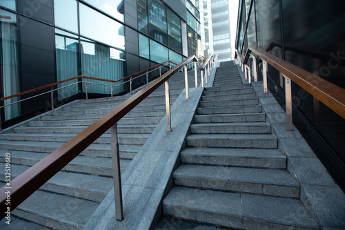 Closeup staircase in a big city leading to multi-storey modern houses. 01.20 Milan.