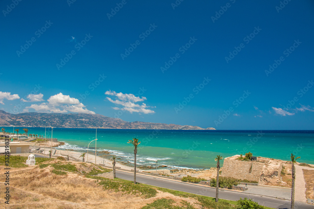 Heraklion city, beach view. Central street of Heraklion with sea and sky.
