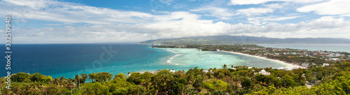 Tropical beach with white sandy coast and turquoise sea. Tropical destination. Summer vacations