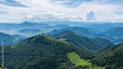 Panorama of mountains and blue sky, misty horizon