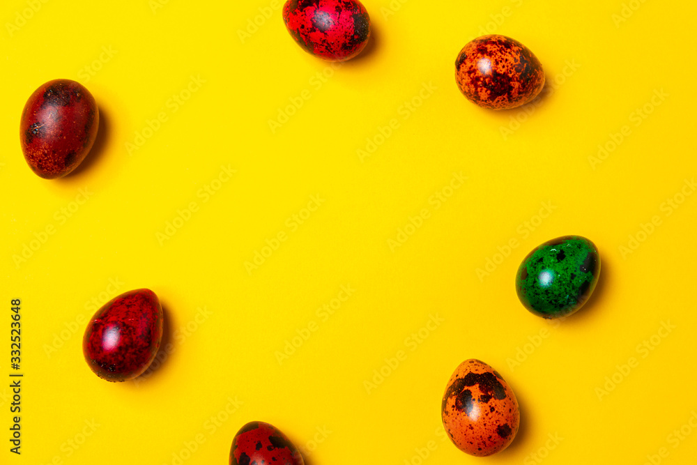 Easter card concept. Lot of easter eggs on a yellow background. Background with space to text. Easter mocku up Easter card concept. Lot of easter eggs on a yellow background. Background with space to text. Easter mocku up