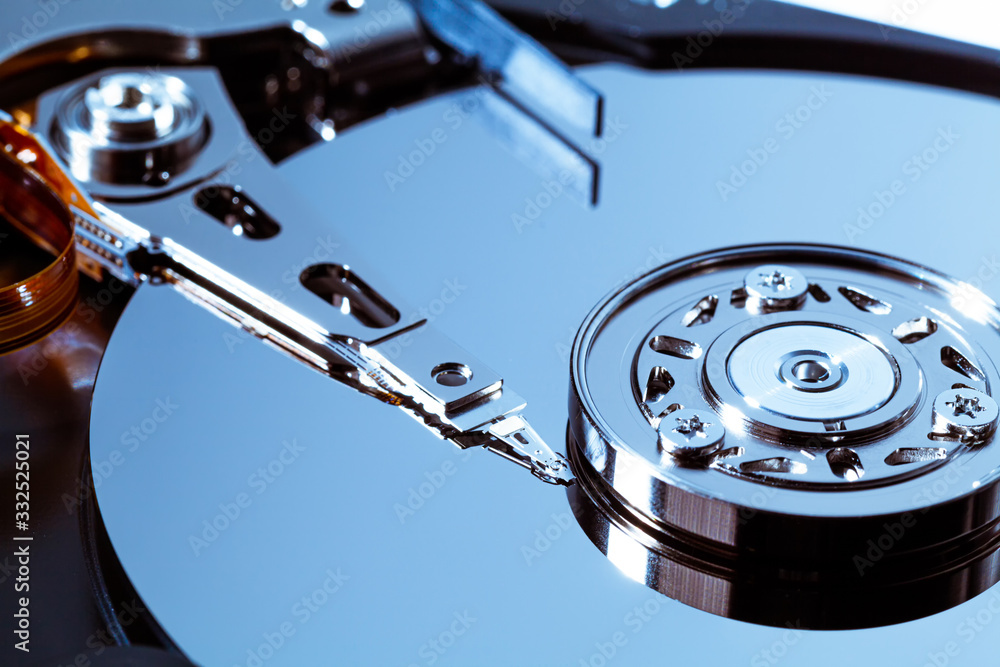 An open computer hard drive for repair. HDD. Components for ps. Storage and restoration of digital data. An open computer hard drive for repair. HDD. Components for ps. Storage and restoration of digital data.