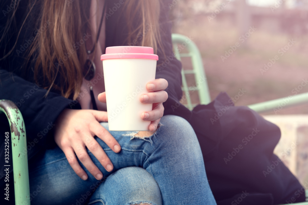Female hands hold reusable coffee mug.Sustainable lifestyle concept. Female hands hold reusable coffee mug.Sustainable lifestyle concept.