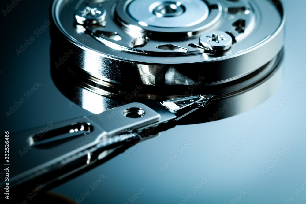An open computer hard drive for repair. HDD. Components for ps. Storage and restoration of digital data. An open computer hard drive for repair. HDD. Components for ps. Storage and restoration of digital data.
