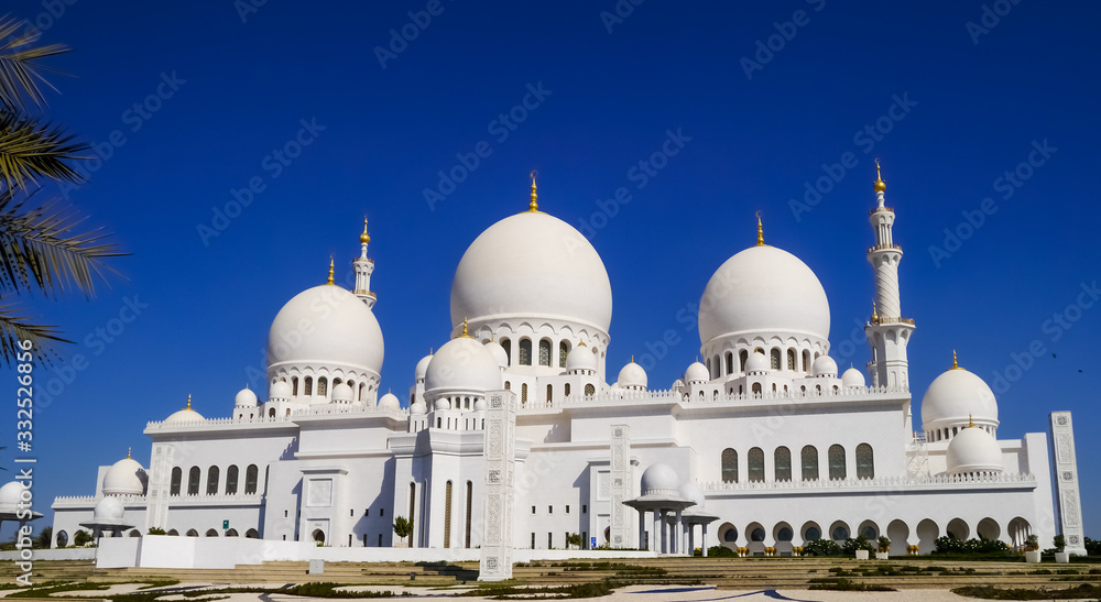 Outside view of the marble domes and the minaret of Sheikh Zayed Mosque in Abu Dhabi