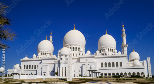 Outside view of the marble domes and the minaret of Sheikh Zayed Mosque in Abu Dhabi