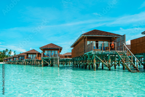 Maldives tropical Island, beautiful isolated luxury water bungalows Maldives in the blue green ocean of the maldives
