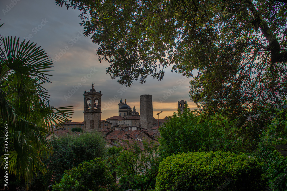 Bergamo at sunset in the old city with towers and bell tower, Bergamo at sunset in the old city with towers and bell tower,