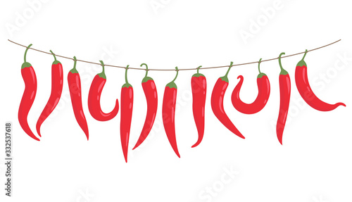 Red peppers hang on a rope.