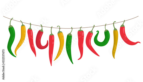 Colorful peppers hang on a rope.