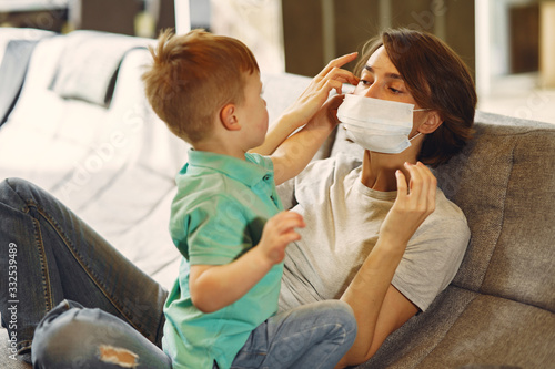 Family stay at home. Mother with little son. Coronavirus theme. photo