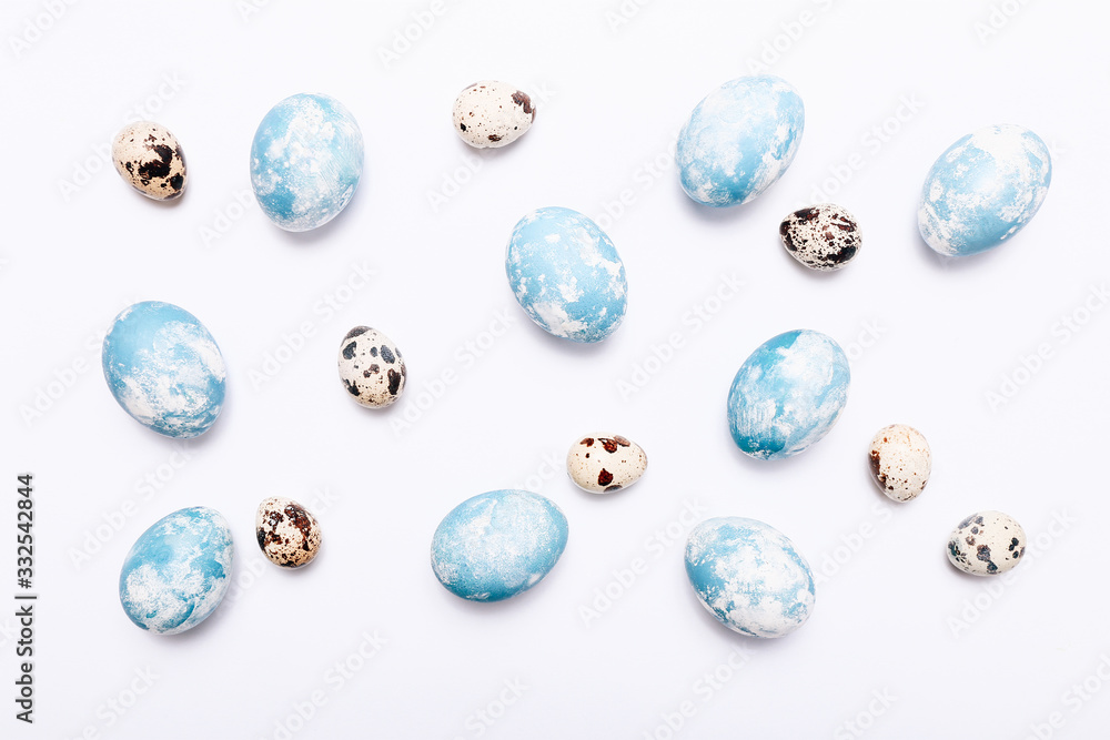 Stylish eggs with ombre blue marble stone effect on white background Stylish eggs with ombre blue marble stone effect on white background