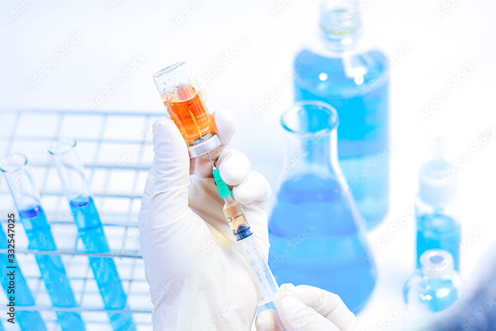 scientist in laboratory with test tubes scientist in laboratory with test tubes