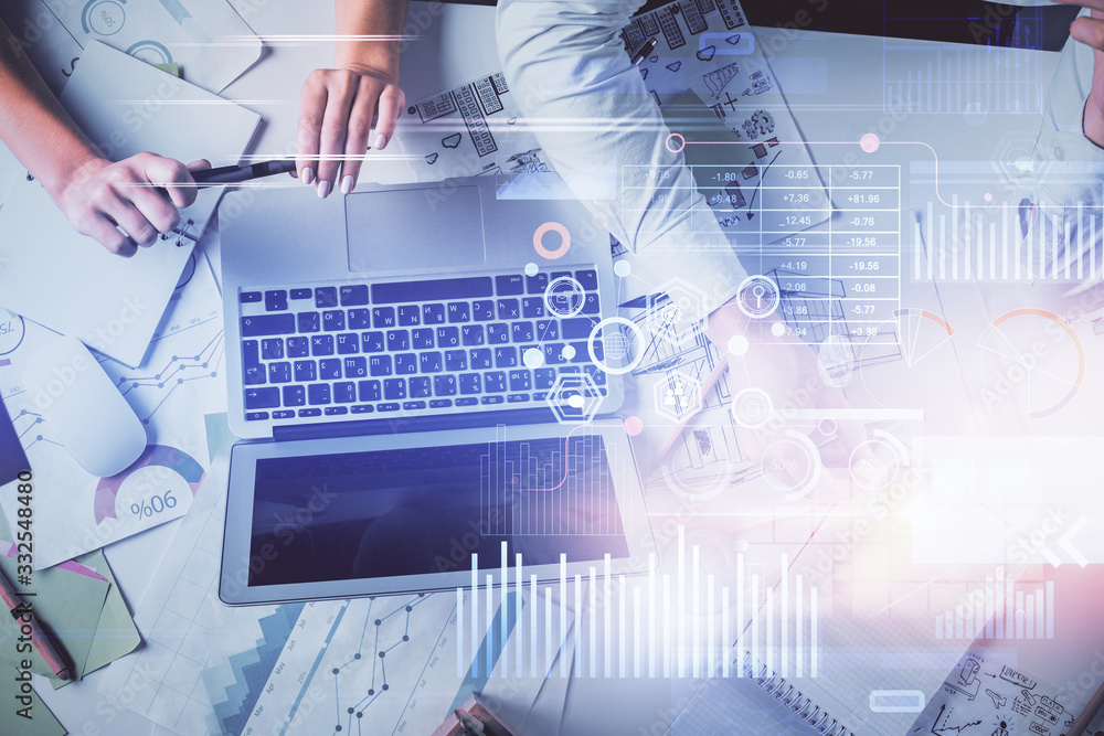 Double exposure of man and woman working together and technology theme drawing hologram. Big data concept. Computer background. Double exposure of man and woman working together and technology theme drawing hologram. Big data concept. Computer background.