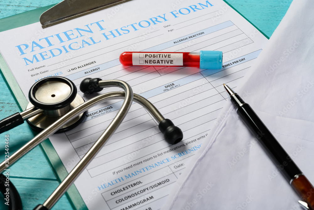 blood test tube with positive result and the patient history form the X ...