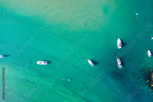 Aerial View from the Beach, Green Trees, Boats in the Sea and Waves of Omaha in New Zealand - Auckland Area 