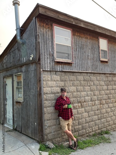 Leaning Against Wooden Shack. photo