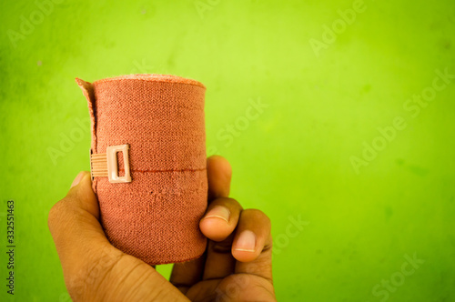 A man holds a bandage