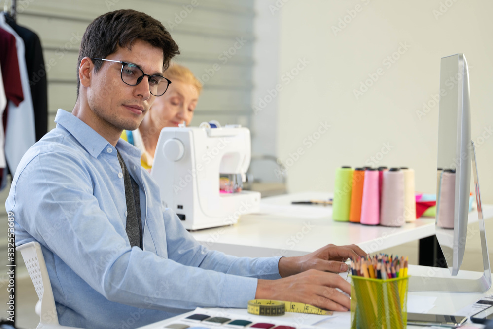 dressmaker and fashion designer working at fashion design studio dressmaker and fashion designer working at fashion design studio