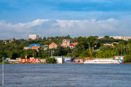 Russia, Khabarovsk, August 2019: Residential buildings on the banks of the Amur river in the city of Khabarovsk in the summer © Beliakina Ekaterina