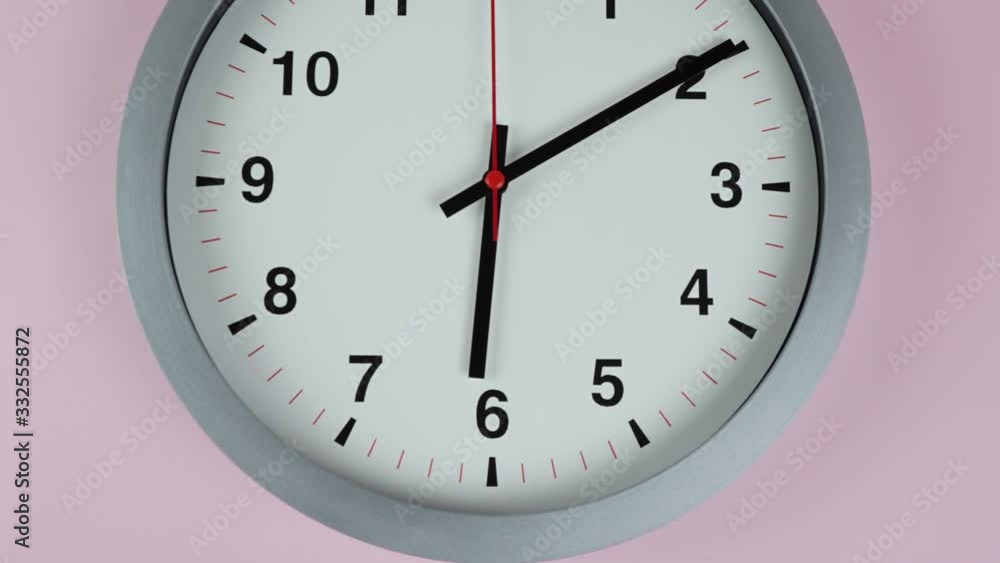 Six o'clock Gray wall watch on Pink background, Time lapse 60 minutes moving fast, Time concept. Six o'clock Gray wall watch on Pink background, Time lapse 60 minutes moving fast, Time concept.