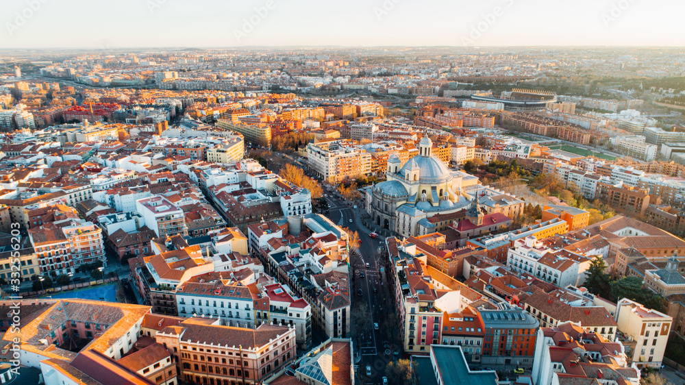 Fototapeta premium Aerial view of Madrid, vivid La Latina district at sunset. Architecture and landmark of Madrid. Cityscape of Madrid. Neighborhoods in capital city of Spain