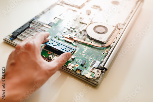 Obraz na płótnie memory module ddr4 ram installation in laptop by hand