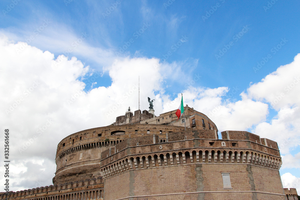View of Castel Sant'Angelo with the dramatic clouds on a sunny day, Rome, Italy