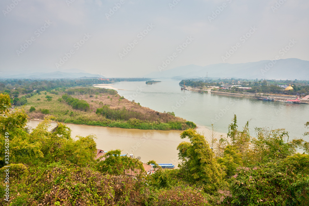 view of golden triangle in chiang rai with 2 river color in contrast