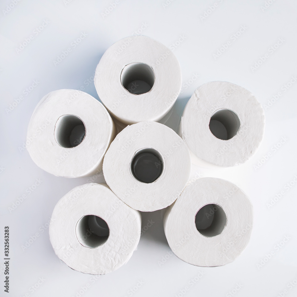 Rolls of toilet paper on a white background. Panic purchase of essential goods. The coronavirus epidemic Rolls of toilet paper on a white background. Panic purchase of essential goods. The coronavirus epidemic