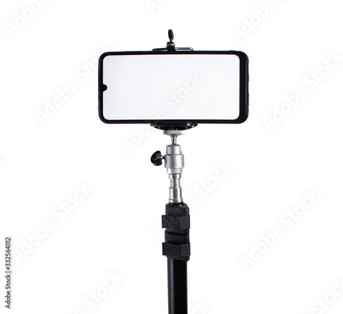 Smartphone mounted on a tripod in a horizontal position on a white isolated background.