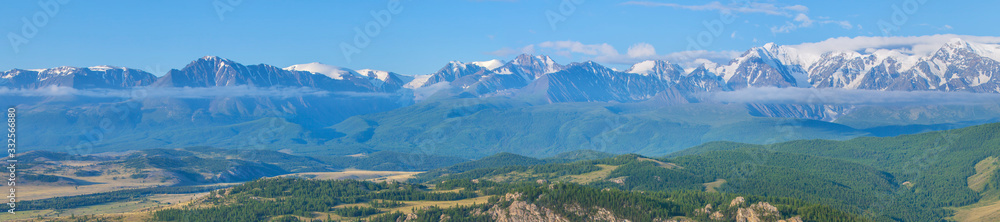 Mountain landscape, sunny summer day. Extra wide panorama. Traveling in the mountains, hiking. 